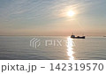 A small cargo ship sailing on the ocean bathed in the morning sun, amidst beautiful natural scenery; live-action video footage available for commercial use. A small cargo ship sailing on the ocean bathed in the morning sun, amidst beautiful natural scenery; live-action video footage available for commercial use. 142319570