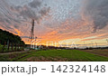 A beautiful sunset, the Japanese countryside, a landscape with transmission towers. 142324148