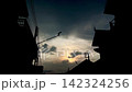 Silhouette of urban buildings at dusk 142324256