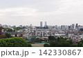 A panoramic view of the Tokyo cityscape, with its rows of buildings. 142330867