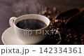 Hot coffee and coffee beans on the table 142334361