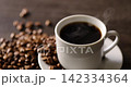 Hot coffee and coffee beans on the table 142334364