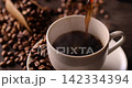 Pour hot coffee into a coffee cup. 142334394
