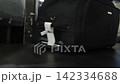 Close up of suitcases being moved by a baggage conveyor at an airport, 4k 142334688