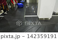 Baggage carousel at an airport with suitcases being picked up, 4k 142359191