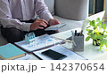Accountant calculating property taxes and mortgage payments at home office. 142370654