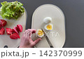 Slicing fresh ingredients for healthy dish 142370999