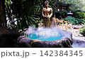 Nonthaburi, THAILAND - July 16, 2026: A peaceful Buddha statue surrounded by a tranquil, mist-covered water feature in Wat Prasat Temple this temple is very famous for tourist at Province Nonthaburi,  142384345