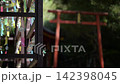 Wind chimes swaying in the summer breeze 142398045