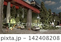An old-style passenger express train runs on a model railway layout. 142408208