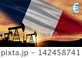 The French flag waves behind crude oil pumps. Euro fuel prices are increasing. 142458741