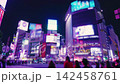 Shibuya Scramble Crossing at night and the neon-lit cityscape of Tokyo, Japan 142458761