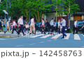 Slow motion footage of people crossing a pedestrian crossing in Marunouchi, Tokyo. 142458763
