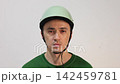 Young cyclist with a protective helmet isolated on white 142459781