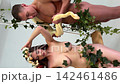 Adam and Eve reenactment with snake and apple 142461486