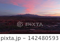 Aerial view of sunrise over red rock mountains in St George Utah USA 142480593