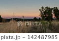 Golden hour light changing over a rural landscape 142487985