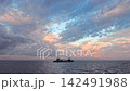A stock clip featuring a magnificent sky and the silhouettes of ships sailing the ocean, conveying the story of logistics and maritime transport. A stock clip featuring a magnificent sky and the silhouettes of ships sailing the ocean, conveying the story of logistics and maritime transport. 142491988