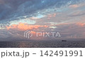 A panoramic view capturing magnificent cloud formations and calm sea surfaces, perfect as a stock clip for environmental footage. A panoramic view capturing magnificent cloud formations and calm sea surfaces, perfect as a stock clip for environmental footage. 142491991