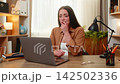 Young woman on home table sees laptop error and feels upset worried disappointed after failed result 142502336