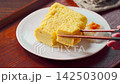 Japanese-style egg dish: Rolled omelet with dashi broth, served with grated daikon radish. Japanese-style egg dish: Rolled omelet with dashi broth, served with grated daikon radish. 142503009