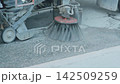 municipal sweeper truck washing and cleaning a city street road surface from dust and dirt. Public utilities maintenance concept. 142509259