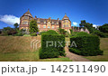 Victorian High Gothic Facade and Blooming Summer Borders at Knightshayes Court 142511490