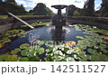 Close Up View of Water Fountain and Lily Pad Pond at Knightshayes Court 142511527