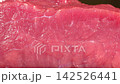 Macro dolly shot moving across fresh raw beef steak showing detailed red muscle fiber texture and succulent meat 142526441