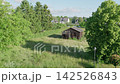 Green lawn and an old wooden barn outdoors village landscape 142526843
