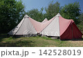 An old tent in the forest, white and red fabric 142528019
