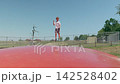 A boy is doing somersaults on a trampoline zoom in 142528402