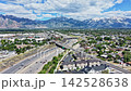 Aerial hyperlapse of Salt Lake City highway interchange and mountains 142528638