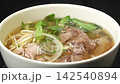 Closeup rotating shot of hot steaming traditional Vietnamese beef pho noodle soup bowl, delicious street food delicacy 142540894