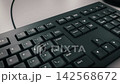 3D animation of a keyboard typing automatically (side view) 142568672