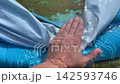 Water draining out of inflatable pool 142593746
