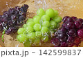 Wash the Shine Muscat and Kyoho grapes under running water. 142599837