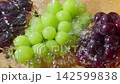 Wash the Shine Muscat and Kyoho grapes under running water. 142599838