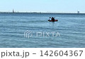 Danish coast with crystal clear water and kayakers 142604367