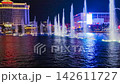 Groups of Vertical Bellagio Fountains Rise Across Lake at Night 142611727