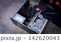 Cleaning dirty dust from CPU heatsink fan during PC maintenance 142620043