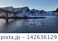 People kayaking in snowy lofoten islands norway at sunrise 142636129