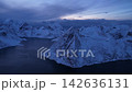 Aerial view of snowy mountain peaks in lofoten islands norway 142636131