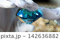 Captivating craft of shimmering blue diamond in a luxurious display 142636882