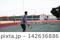Enjoying a sunny day of tennis practice on a beautiful court 142636886
