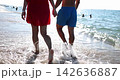 Charming moments by the sea as a couple strolls along the shore 142636887