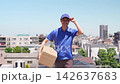 Delivery drivers carrying packages under the blue sky 142637683