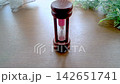 An hourglass placed on a wooden table 142651741