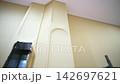 Hole for air duct maintenance and textured beige column 142697621