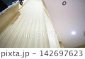 Air duct metal pipe near textured beige column on wall 142697623